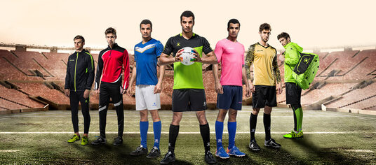 Players lined up in assorted teamwear kits